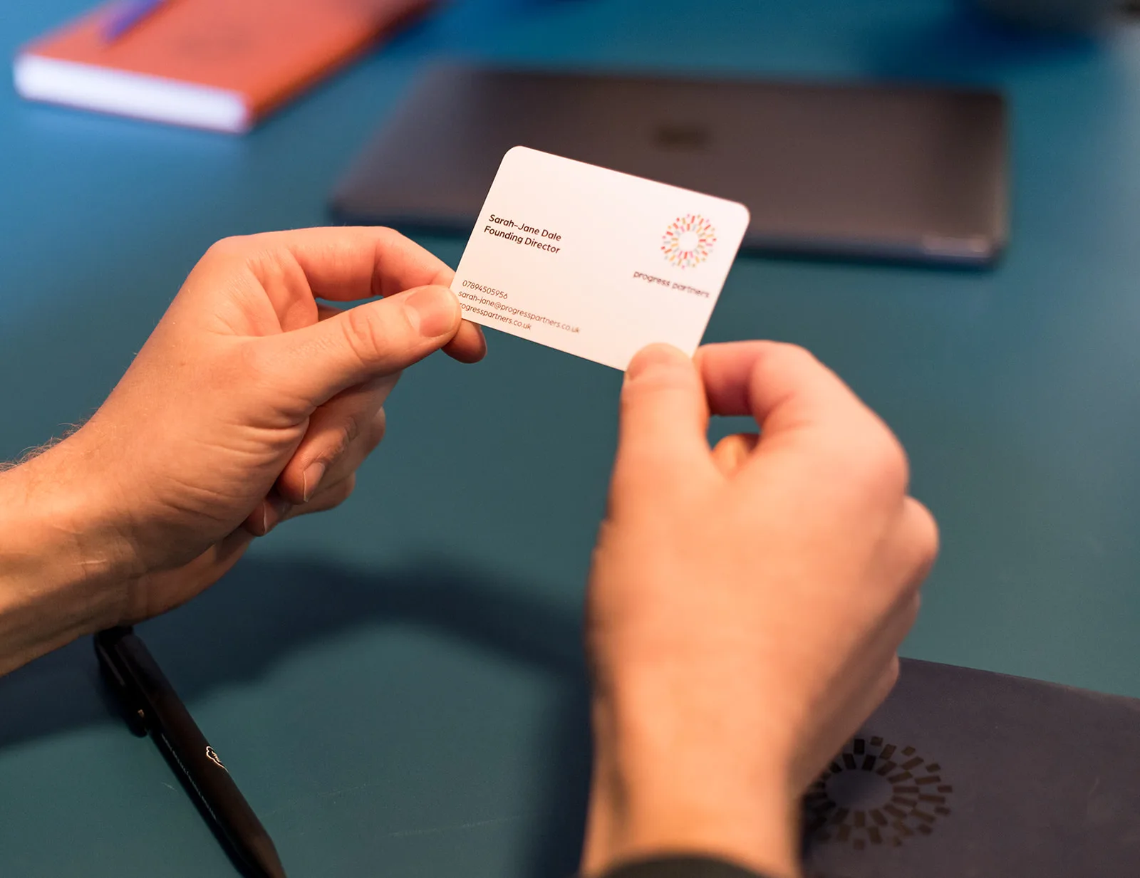 Client Holding Business Card Landscape