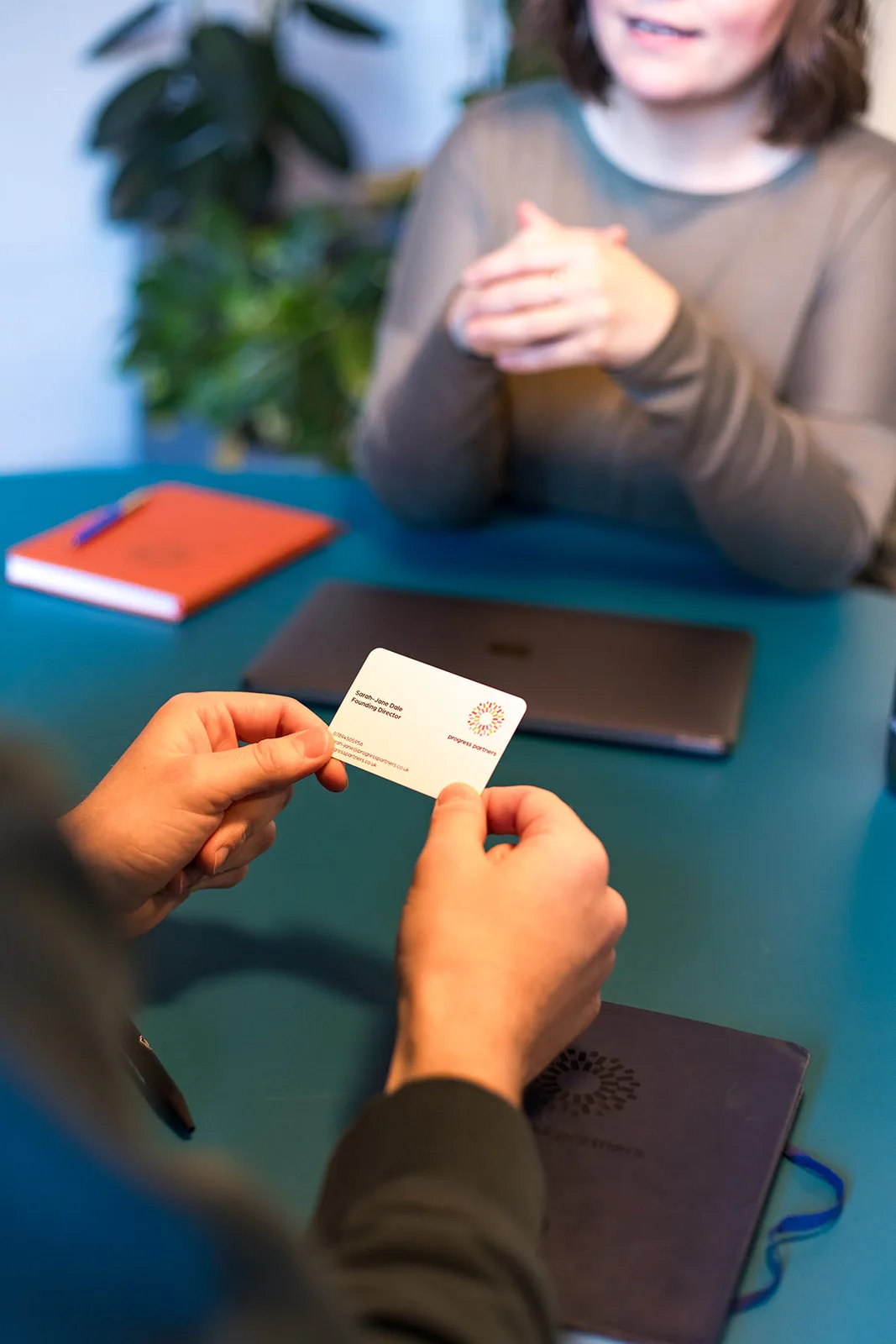 Client Holding Business Card Portrait